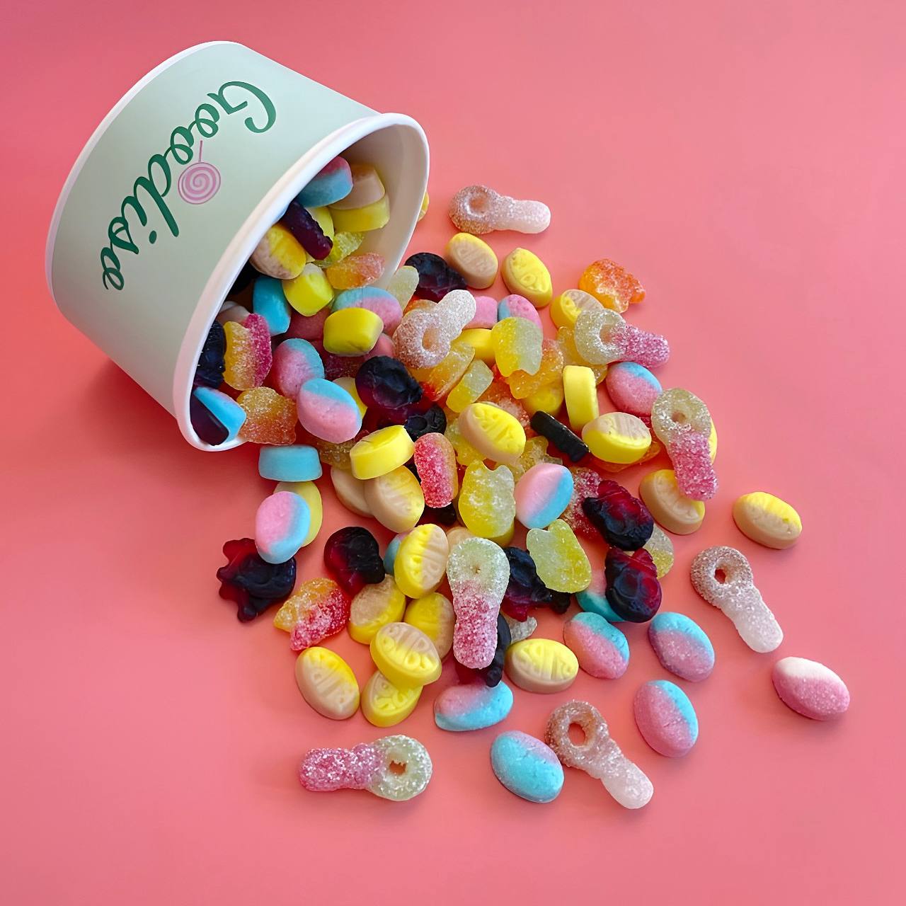A Goodiso cup spilling colorful Swedish candy